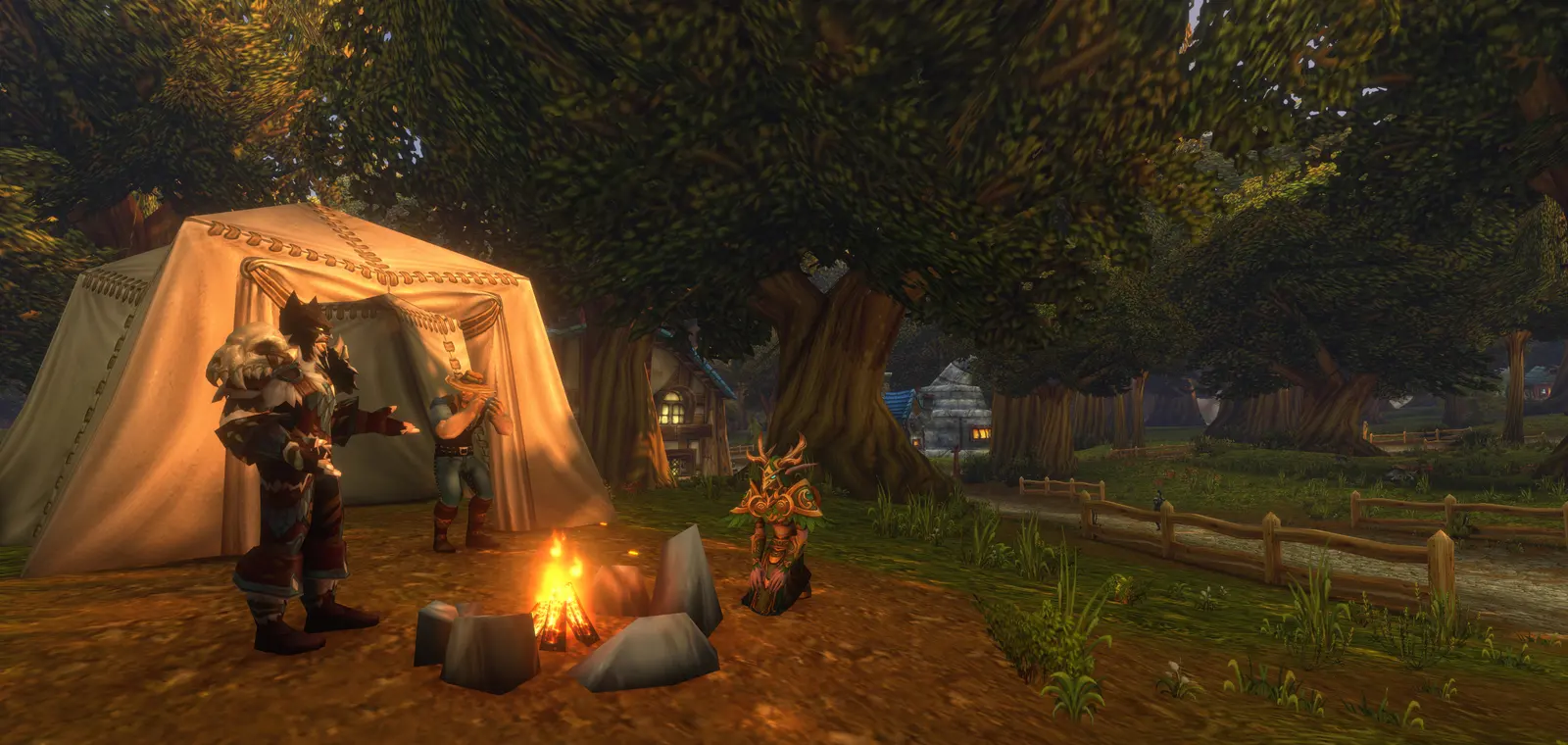 Players resting around a campfire beside a tent at dusk