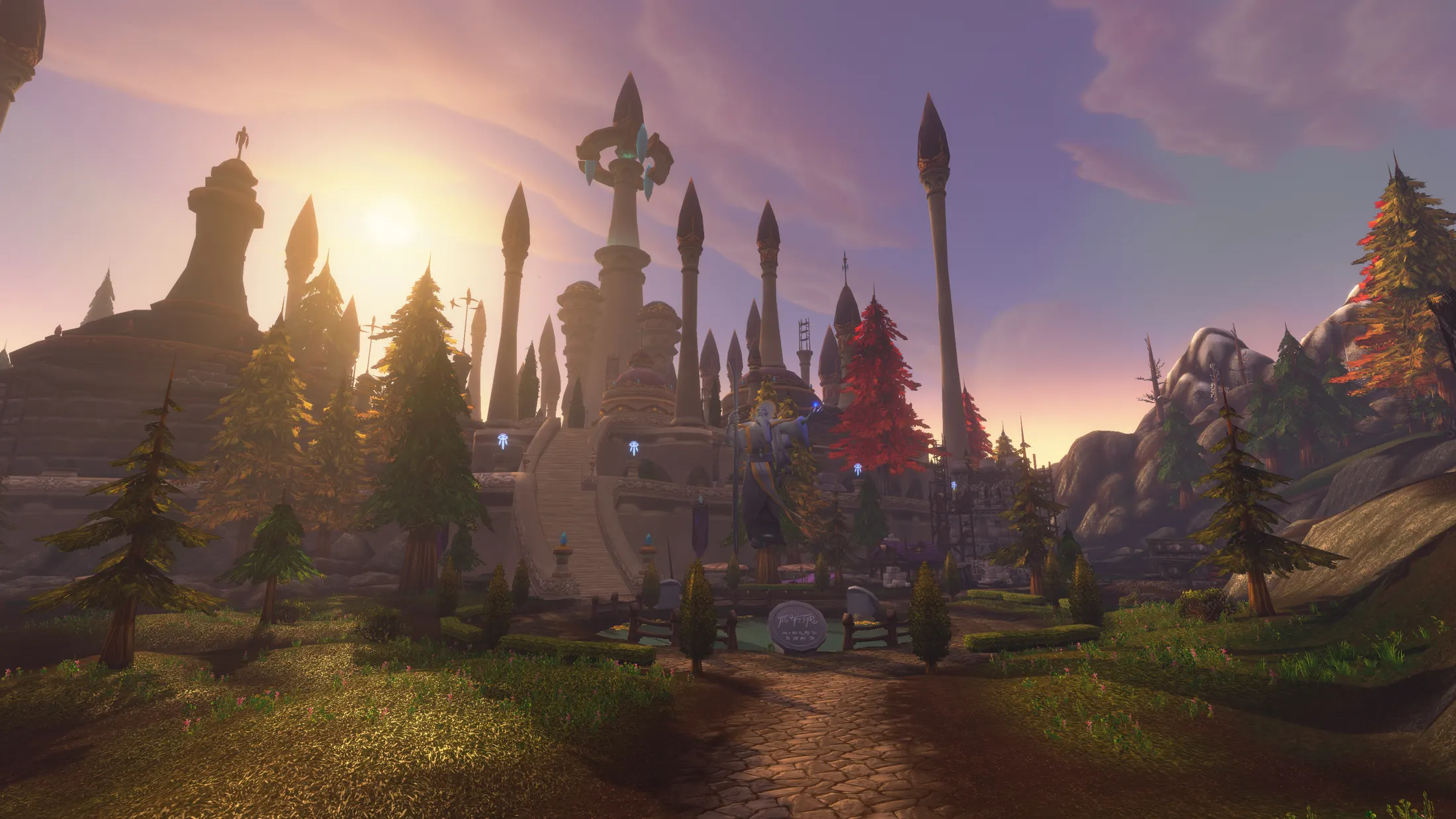 The spires of Dalaran at sunset, with a path leading up to the city